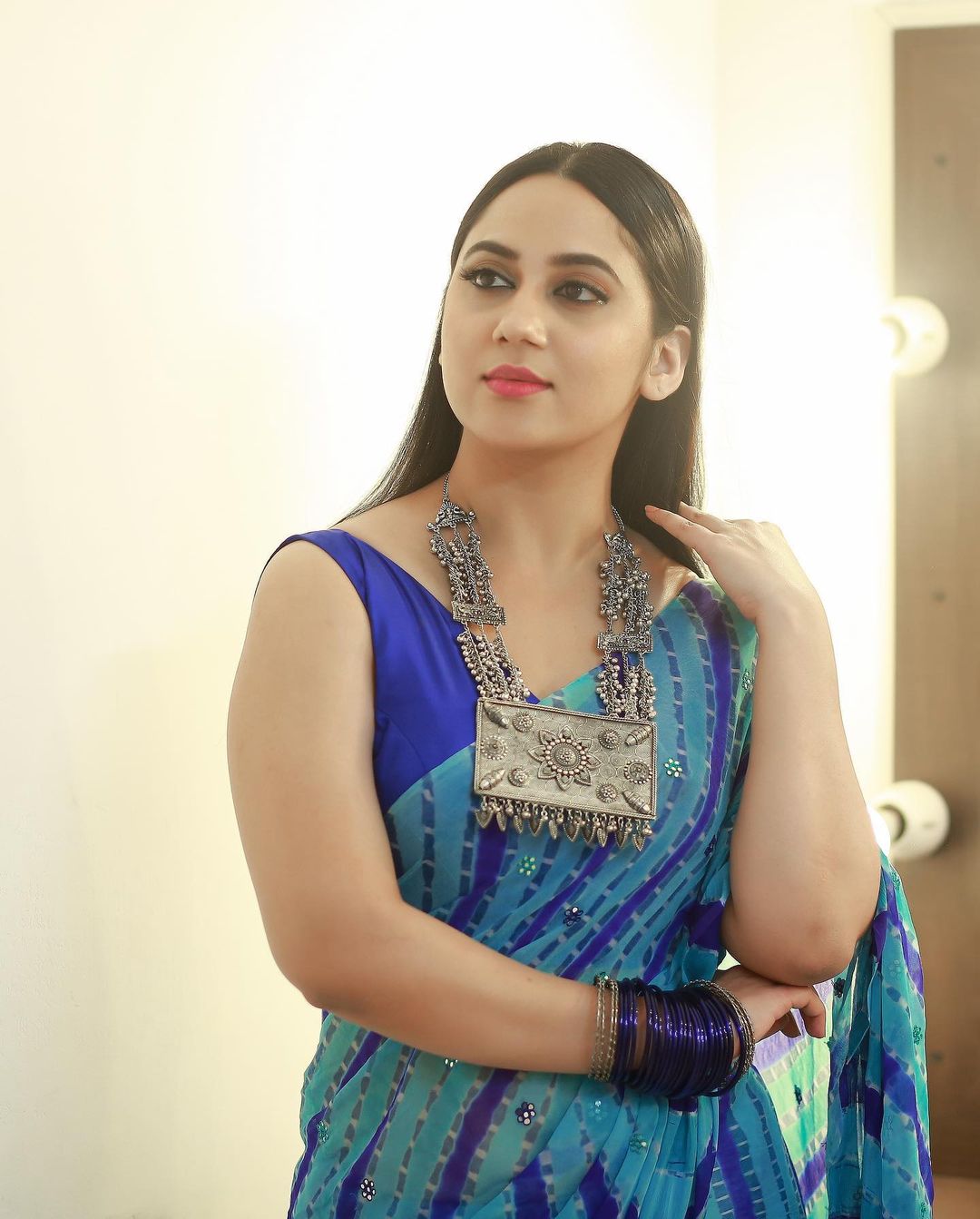 Malayalam Actress Miya George in Sleeveless Blue Saree